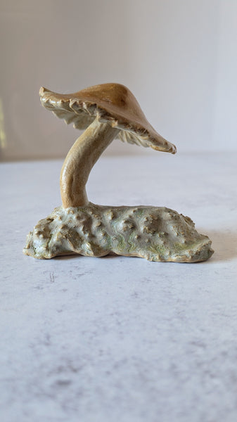 Decorative mushroom sculpture on a marble surface